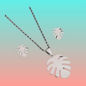 Silver color monstera Pendant and stud earrings.  Recommended removing prior to